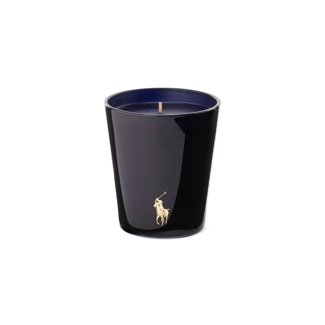 Black candle with gold polo player logo