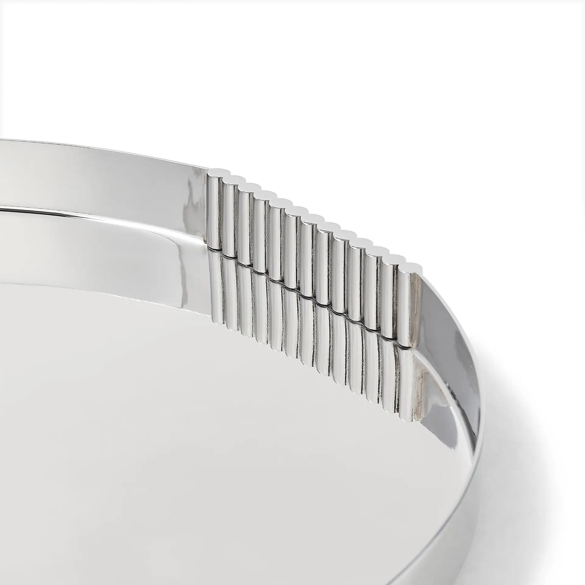 Close-up of silver coin edge on white background