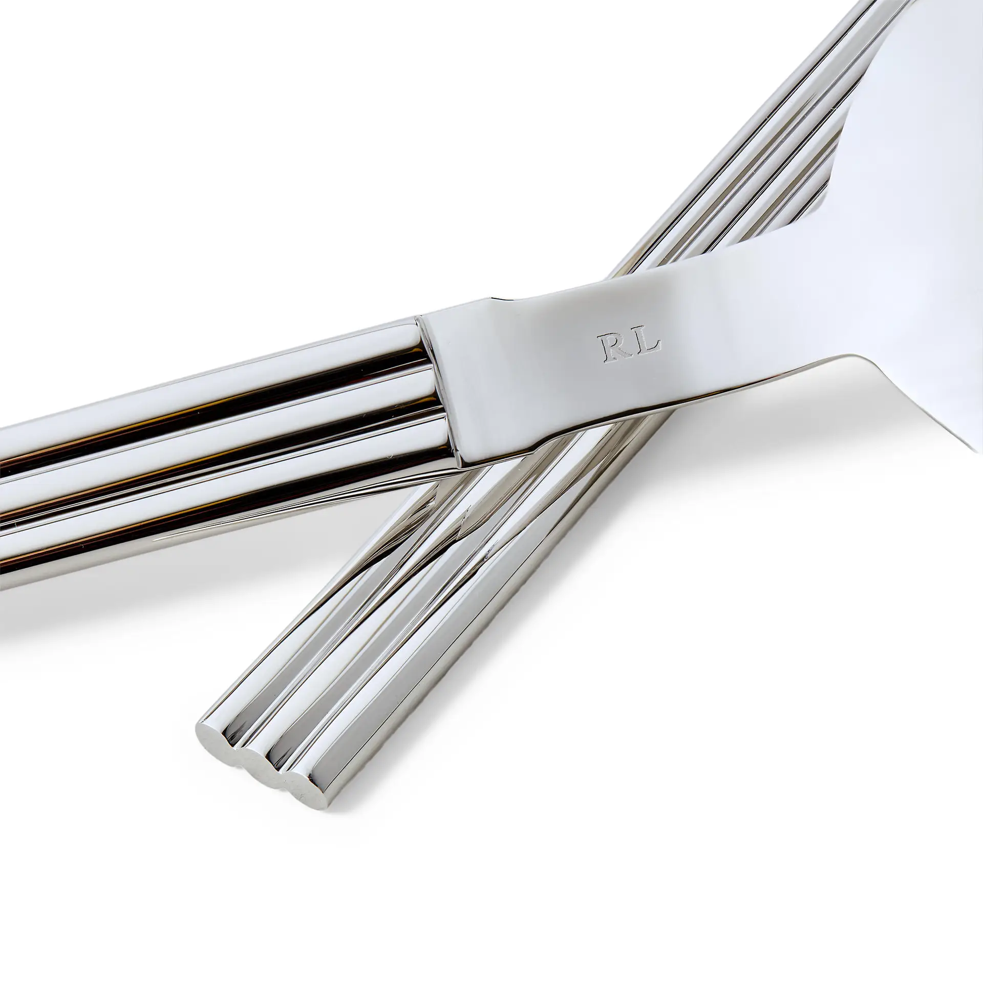 Luxury silver flatware with RL monogram close-up