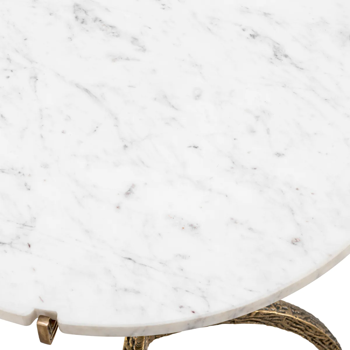 Close-up of white marble tabletop with ornate base