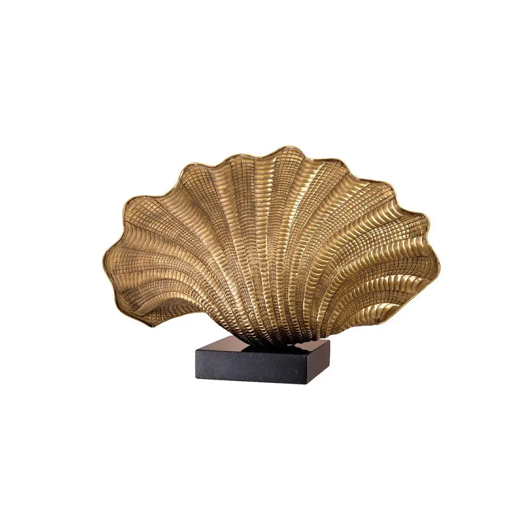 Golden shell sculpture on black base