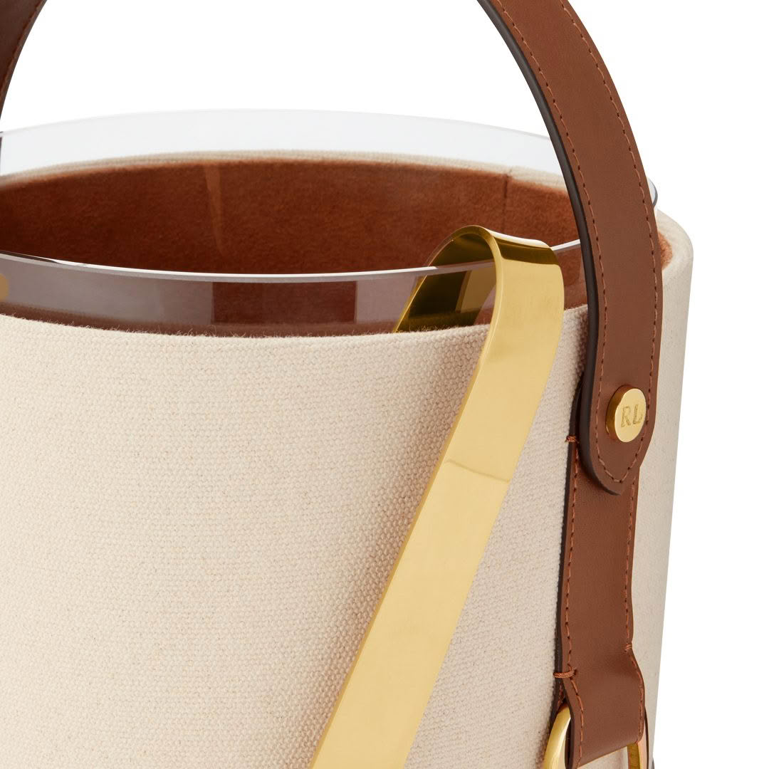 Close-up of tan canvas tote with leather handles