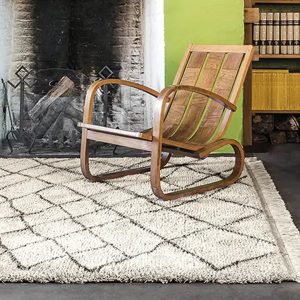 Vintage rocking chair by a fireplace in a cozy room