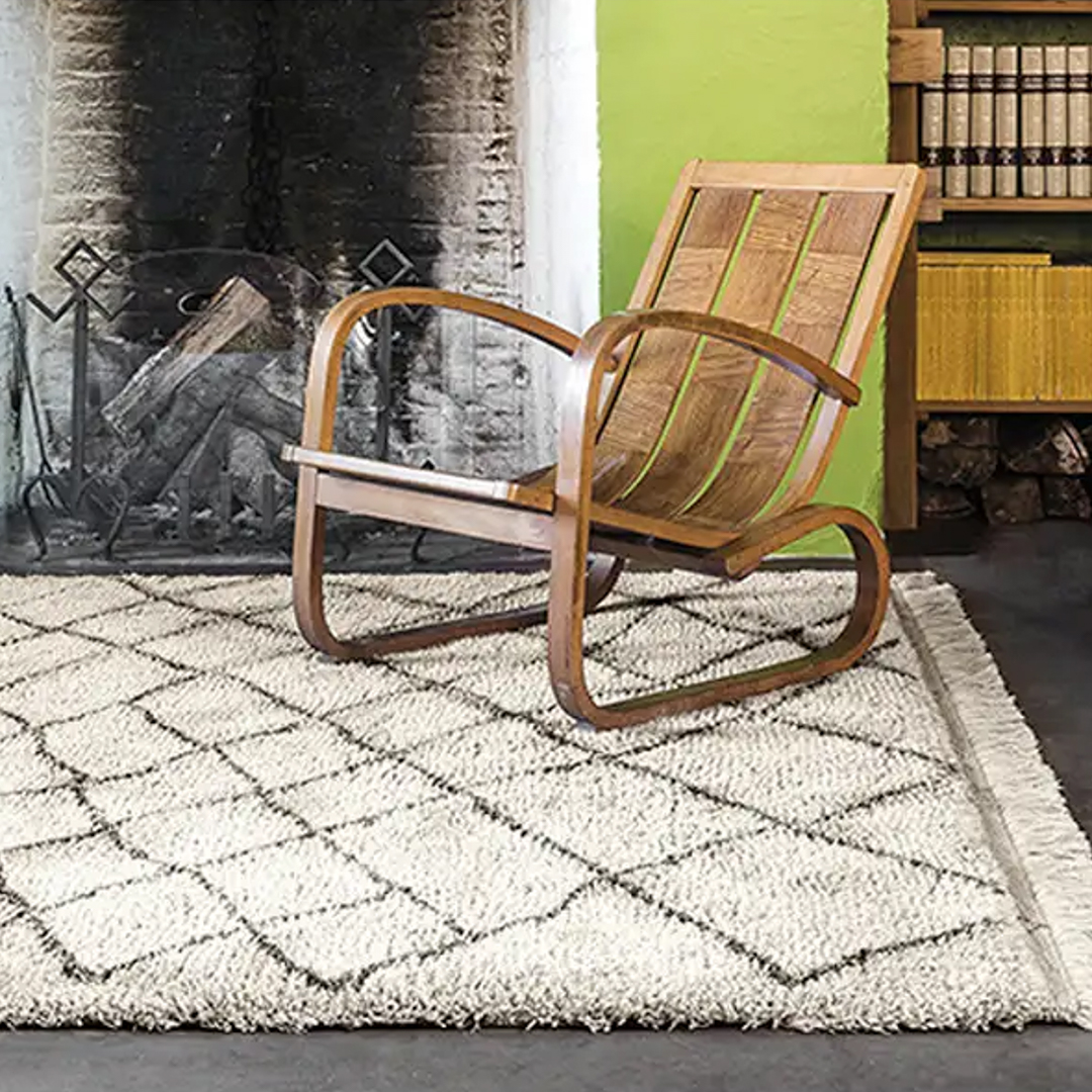 Vintage rocking chair by a fireplace in a cozy room