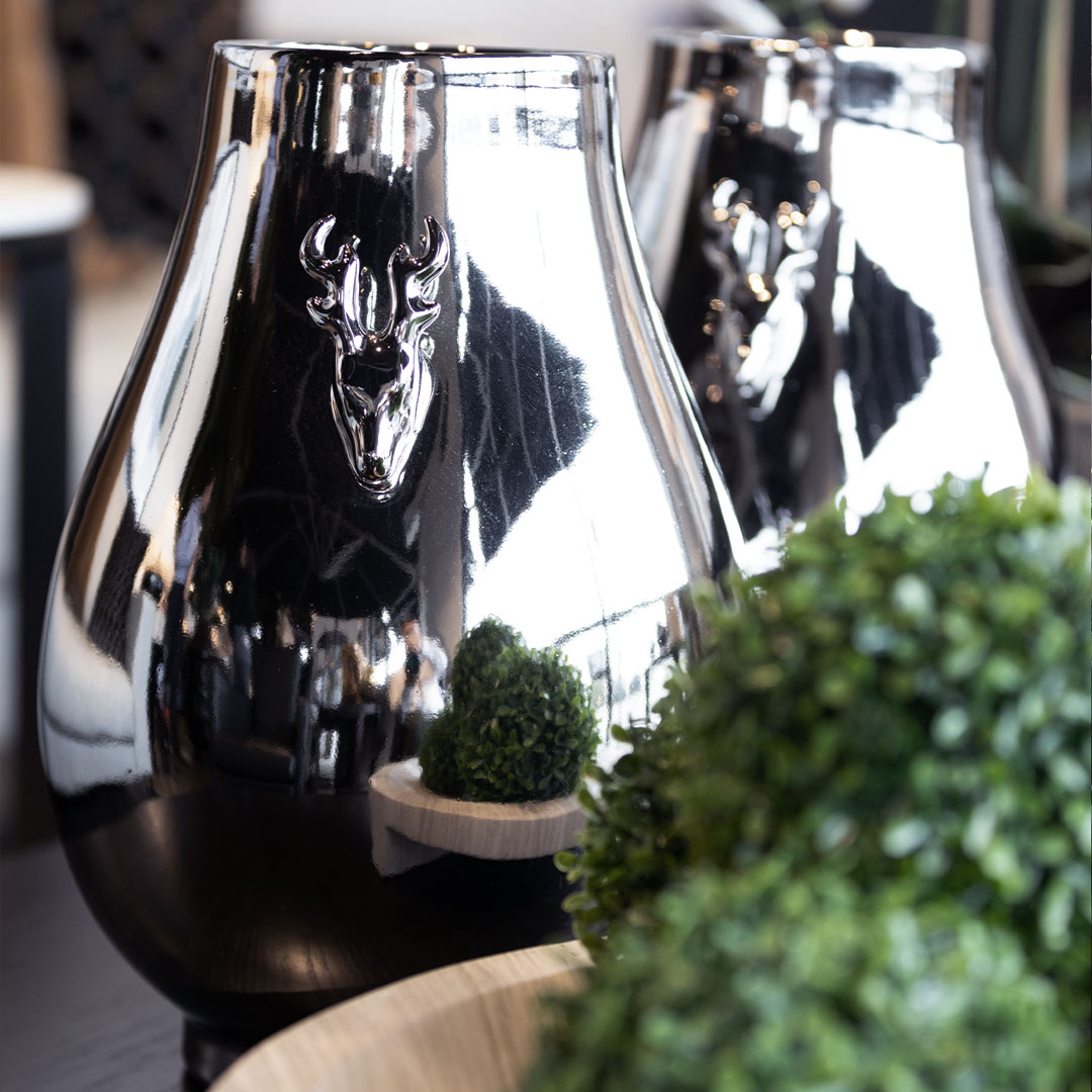 Reflective vases with embossed deer design in modern decor