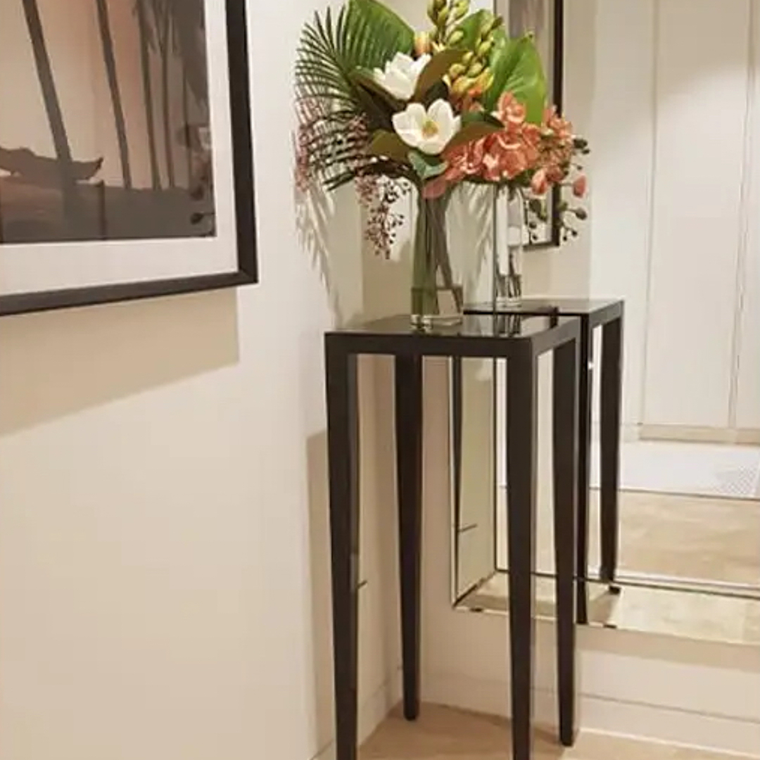 Elegant hallway with floral arrangement and framed picture