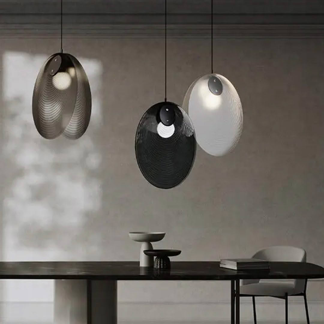 Modern hanging lights over minimalist dining table