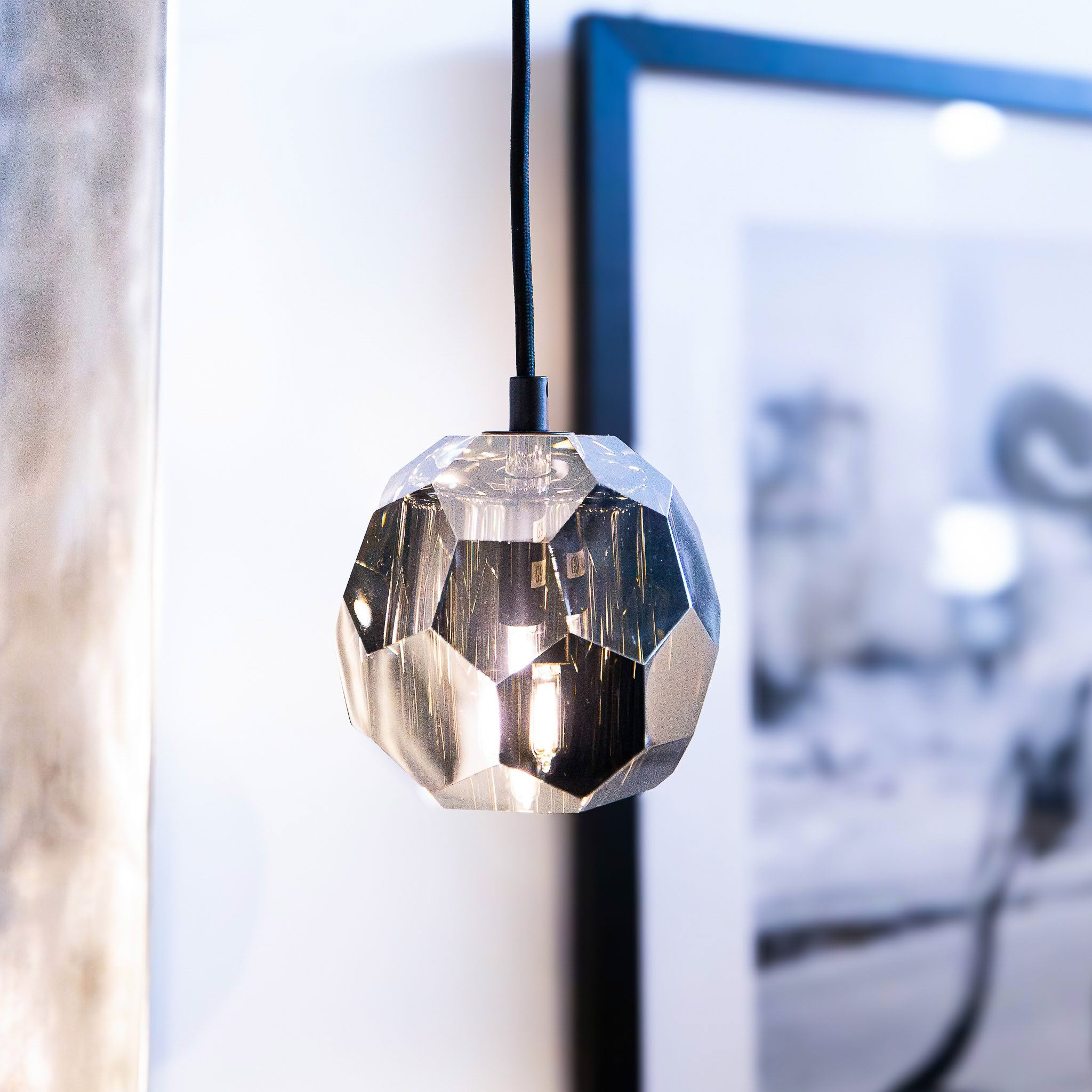 Modern geometric hanging pendant light in room