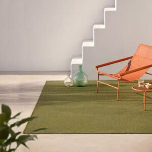 Modern minimalist lounge chair in stylish interior space.