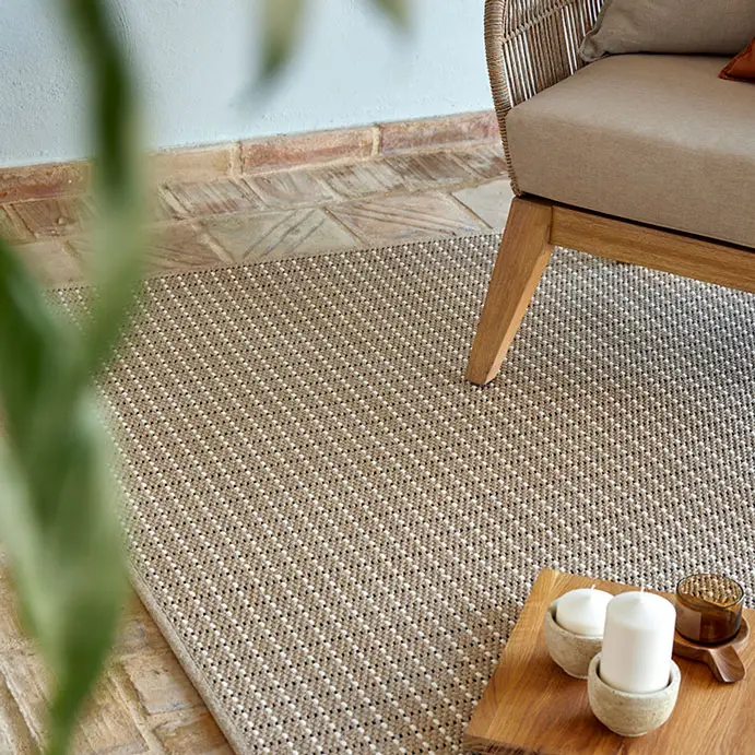 Cozy room with natural rug, wooden chair and decor