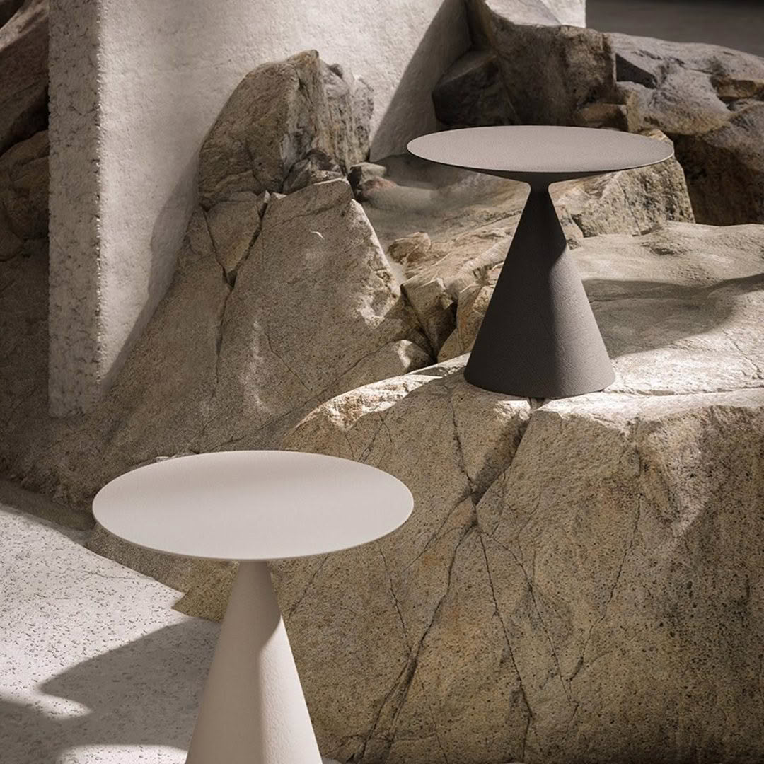 Modern tables in a rocky desert landscape setting