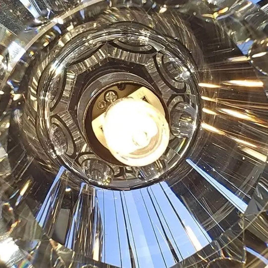 Close-up of illuminated crystal chandelier interior