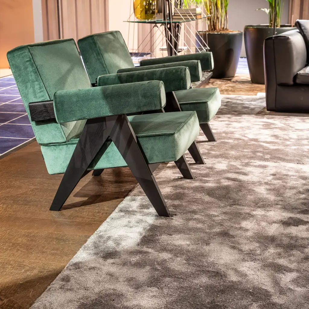 Modern green velvet chairs in stylish interior