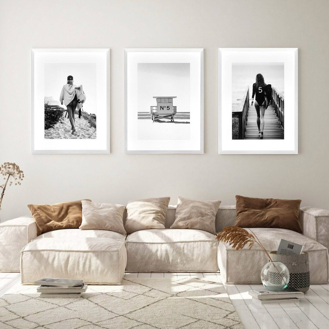 Modern living room with three black-and-white framed photos