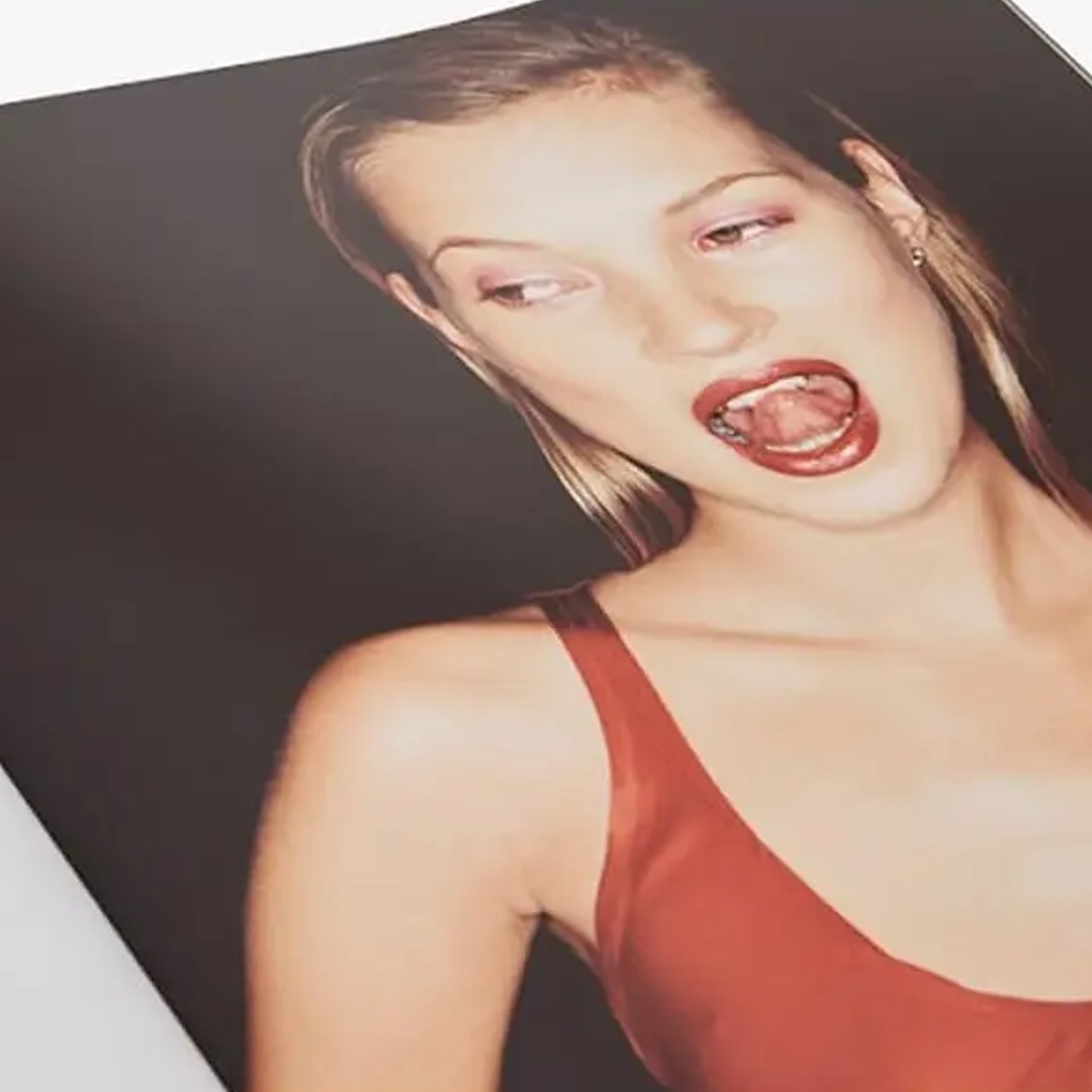 Kate-Moss-Book-web3 (1) Woman in red dress winking playfully