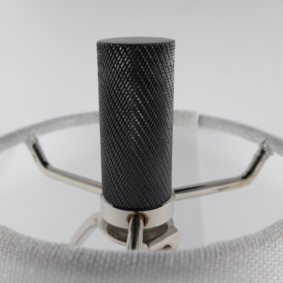 Textured black leather microphone with silver accents