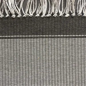 Close-up of textured gray woven fabric with fringe