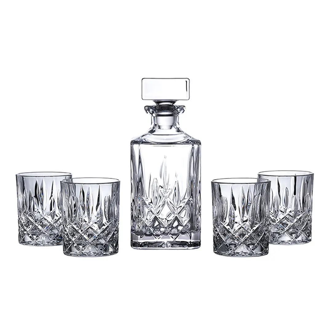 Crystal decanter and glasses set on white background
