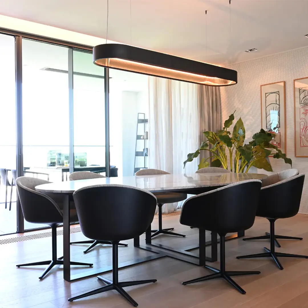 Modern dining room with large window and unique lighting
