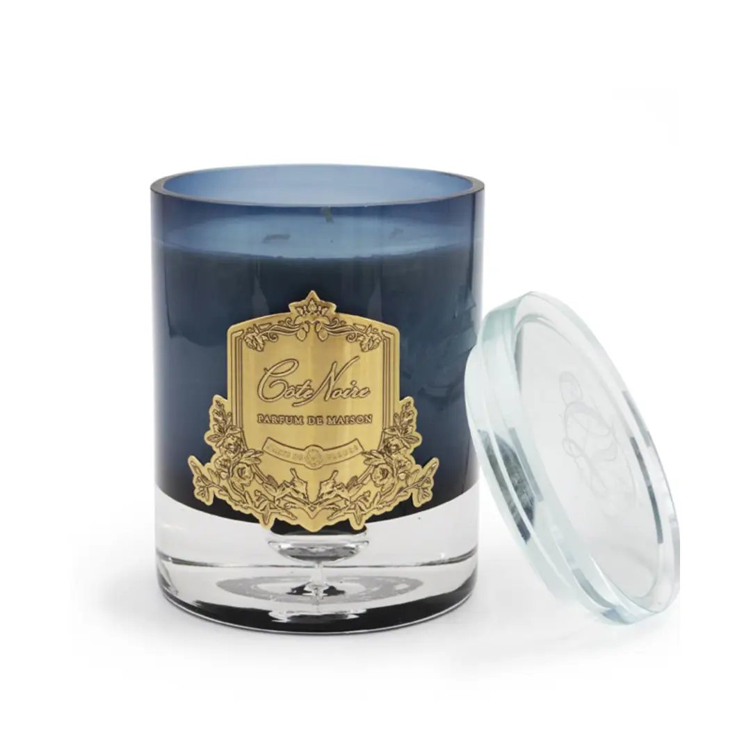 Navy blue scented candle with elegant gold label
