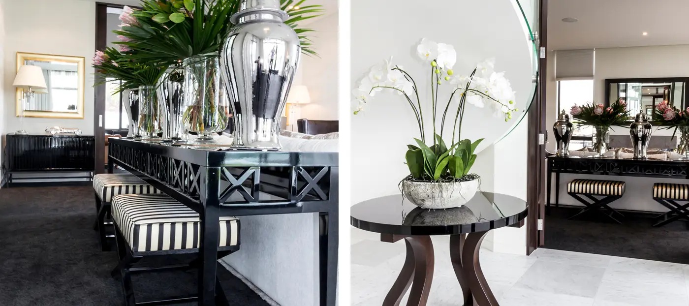 Elegant interior design with decorative silver vases and orchids