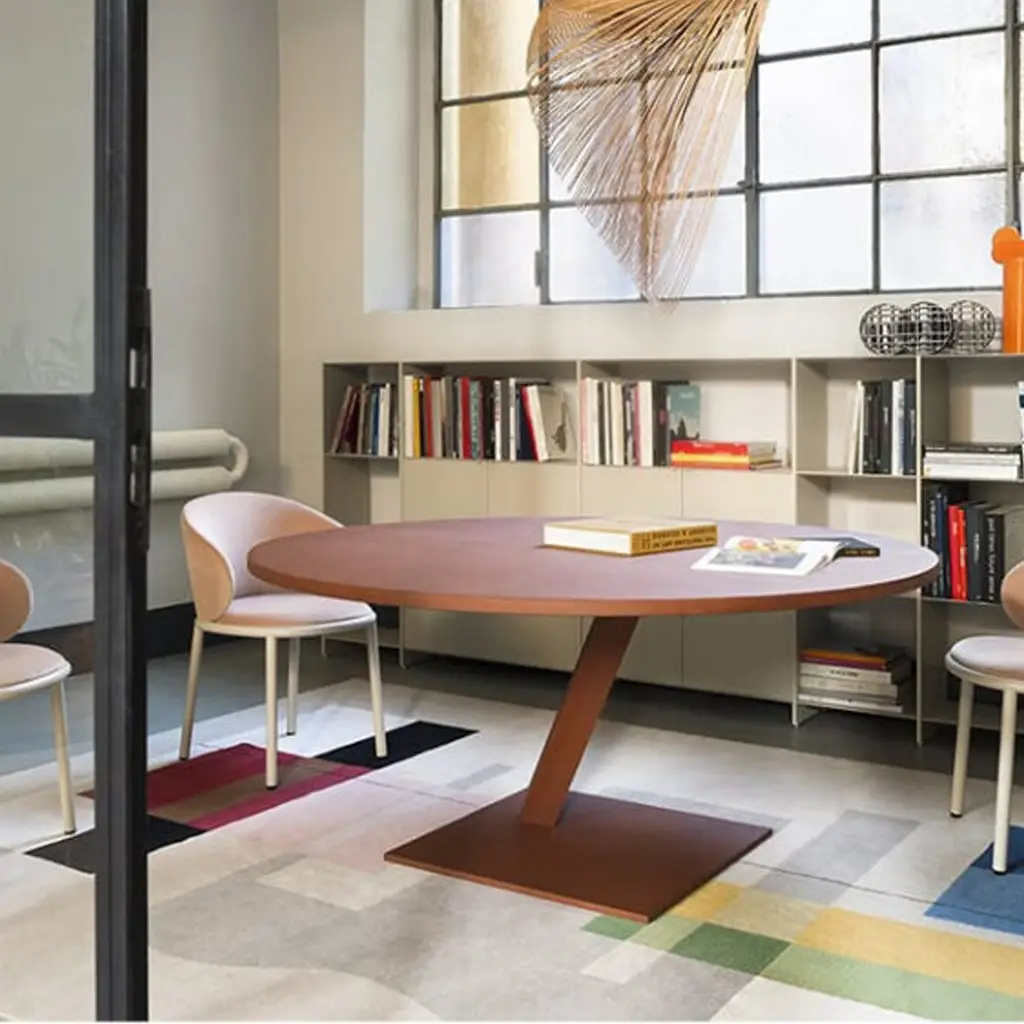 Modern study room with oval table and bookshelf