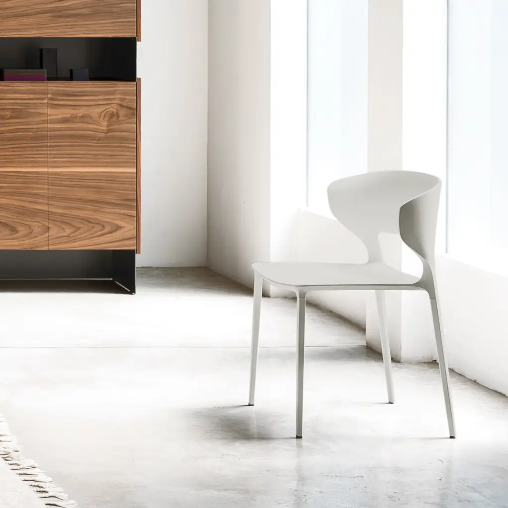 Modern chair and wooden cabinet in bright minimalist room