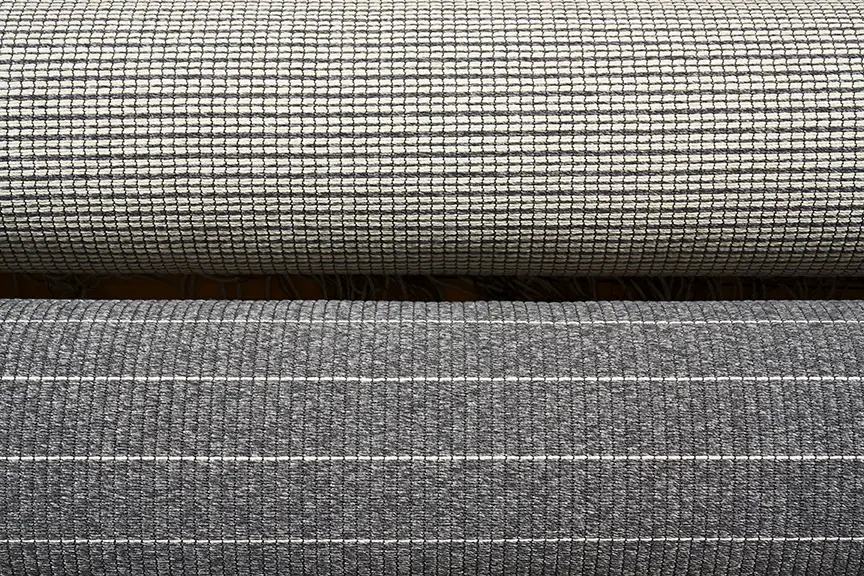 Close-up of textured fabric layers in gray tones