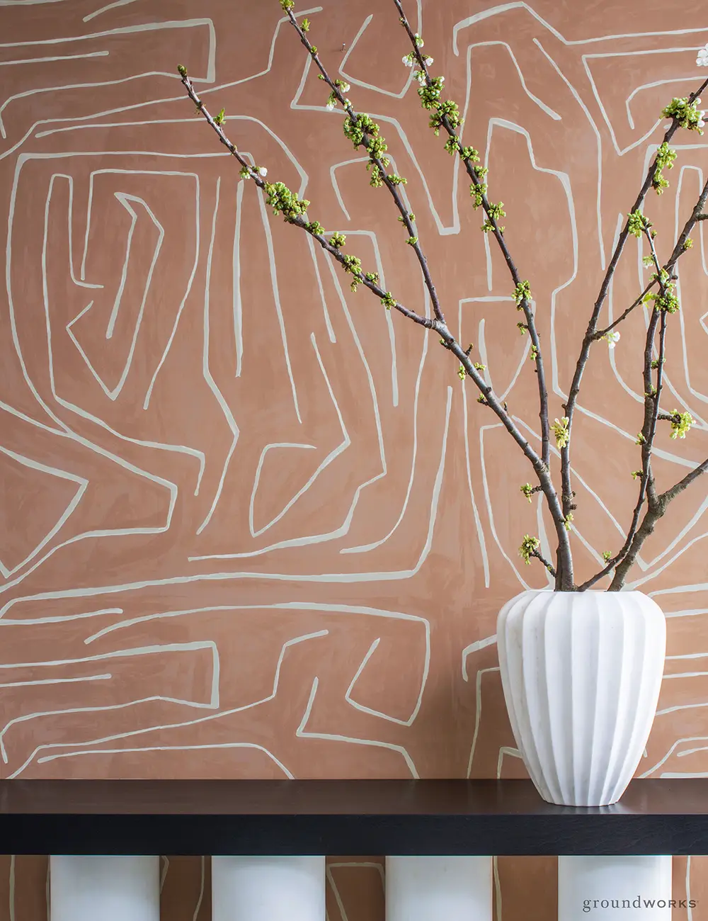 Abstract wall art with blossoming branch in white vase