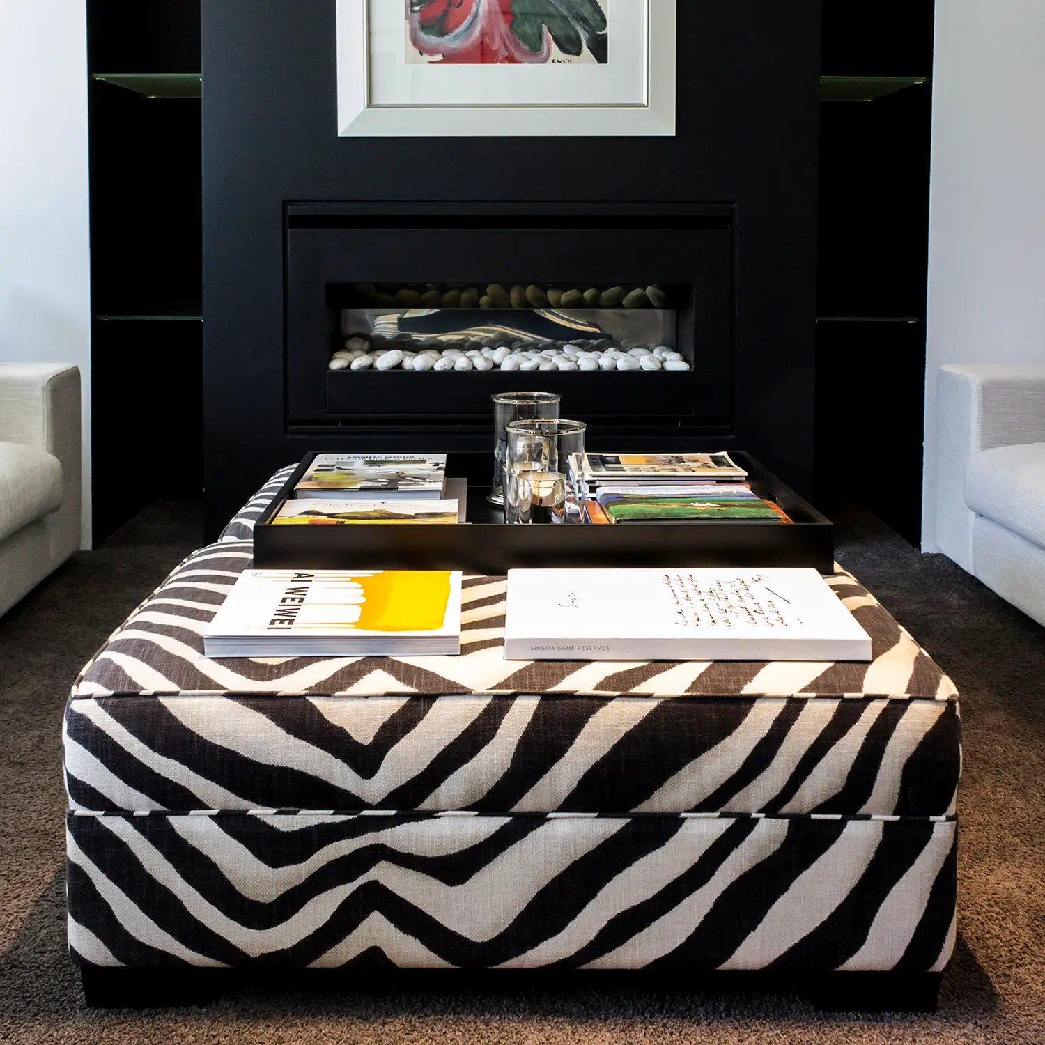 Stylish modern living room with zebra-patterned ottoman