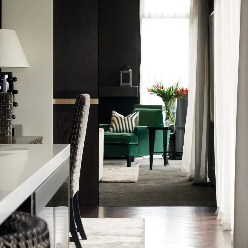 Stylish interior with green chair and elegant decor