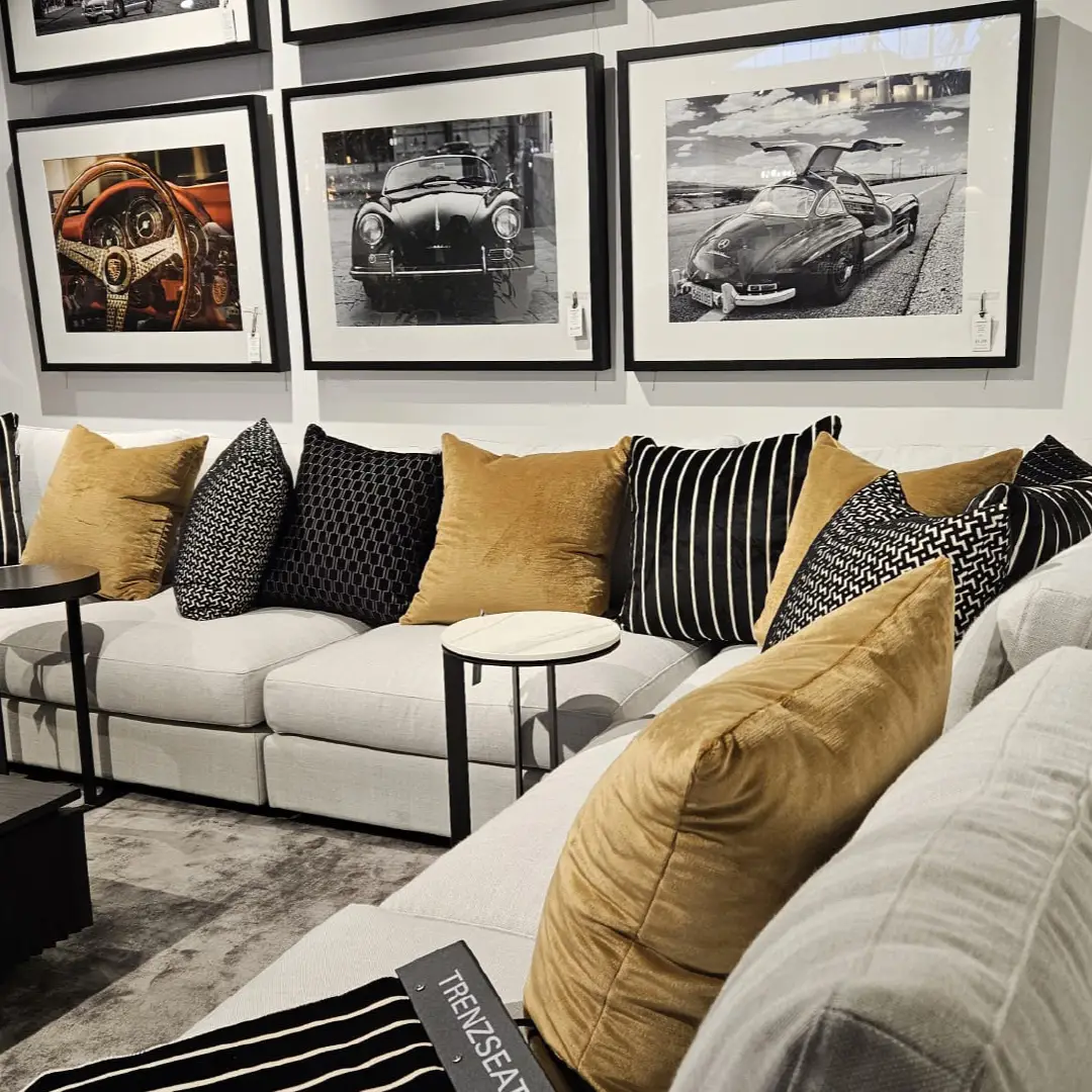 Italia-Sofa Stylish living room with framed vintage car photographs