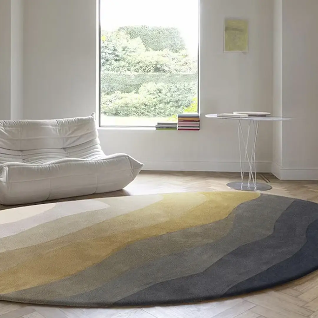 Minimalist living room with modern rug and white chair