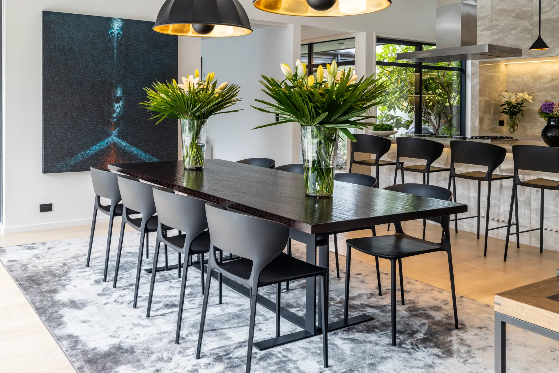 Modern dining room with artistic decor and sleek furniture