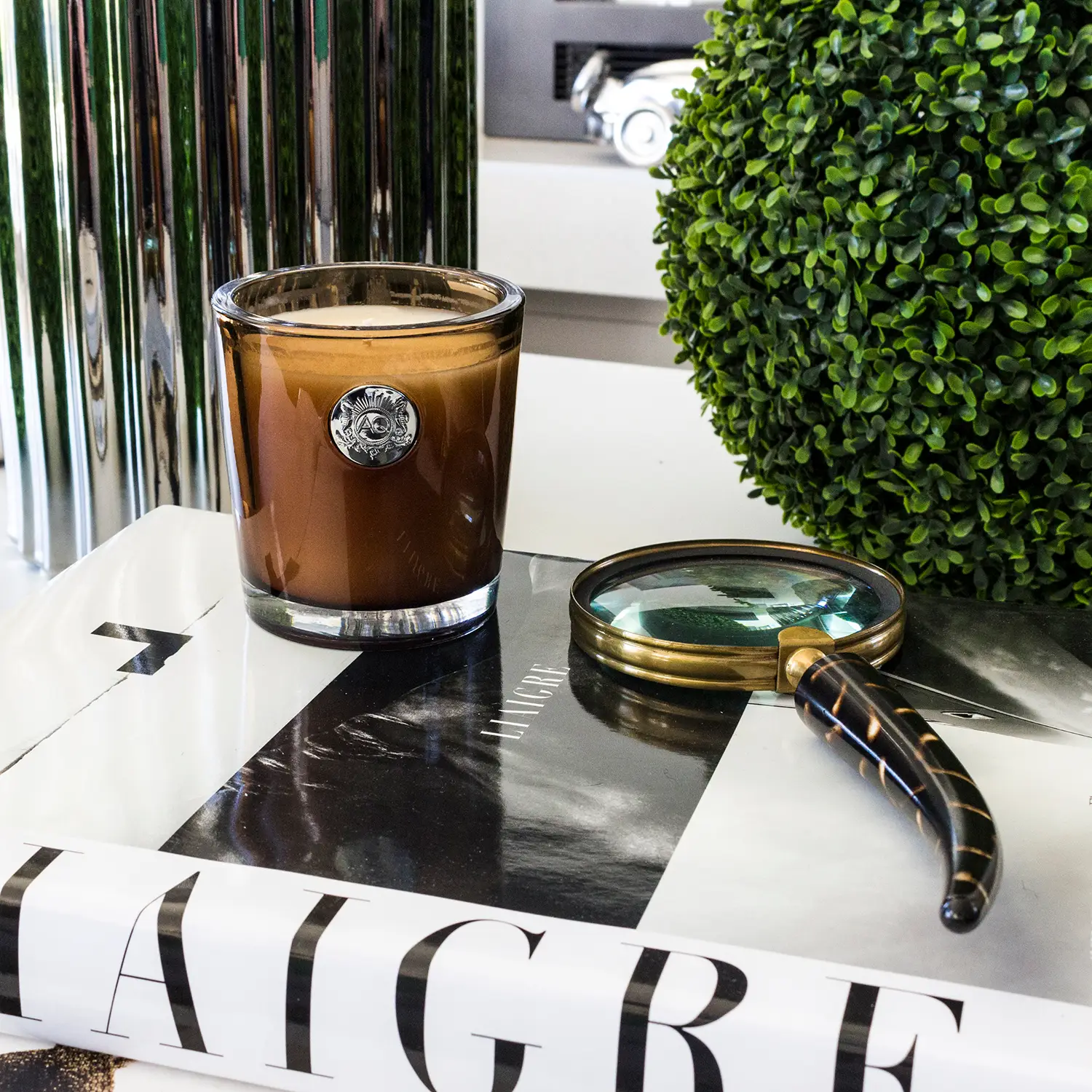 Iced coffee in glass on stylish monochrome table.