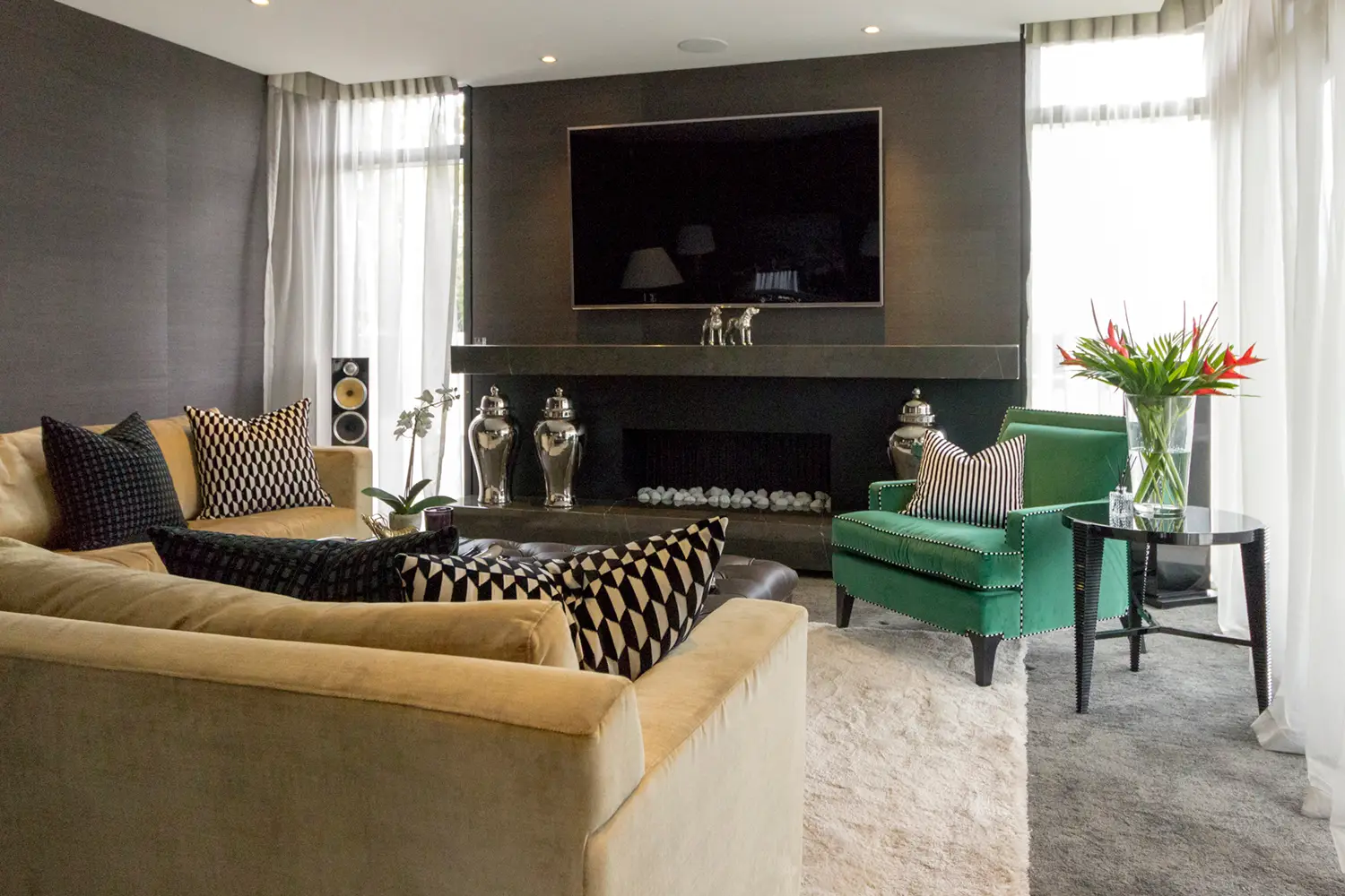 Elegant living room with modern decor and green armchair