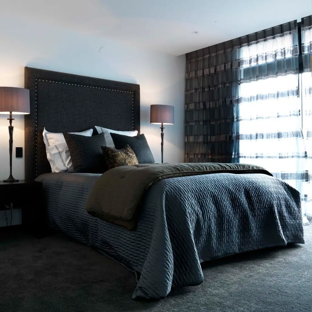 Elegant modern bedroom with large dark headboard