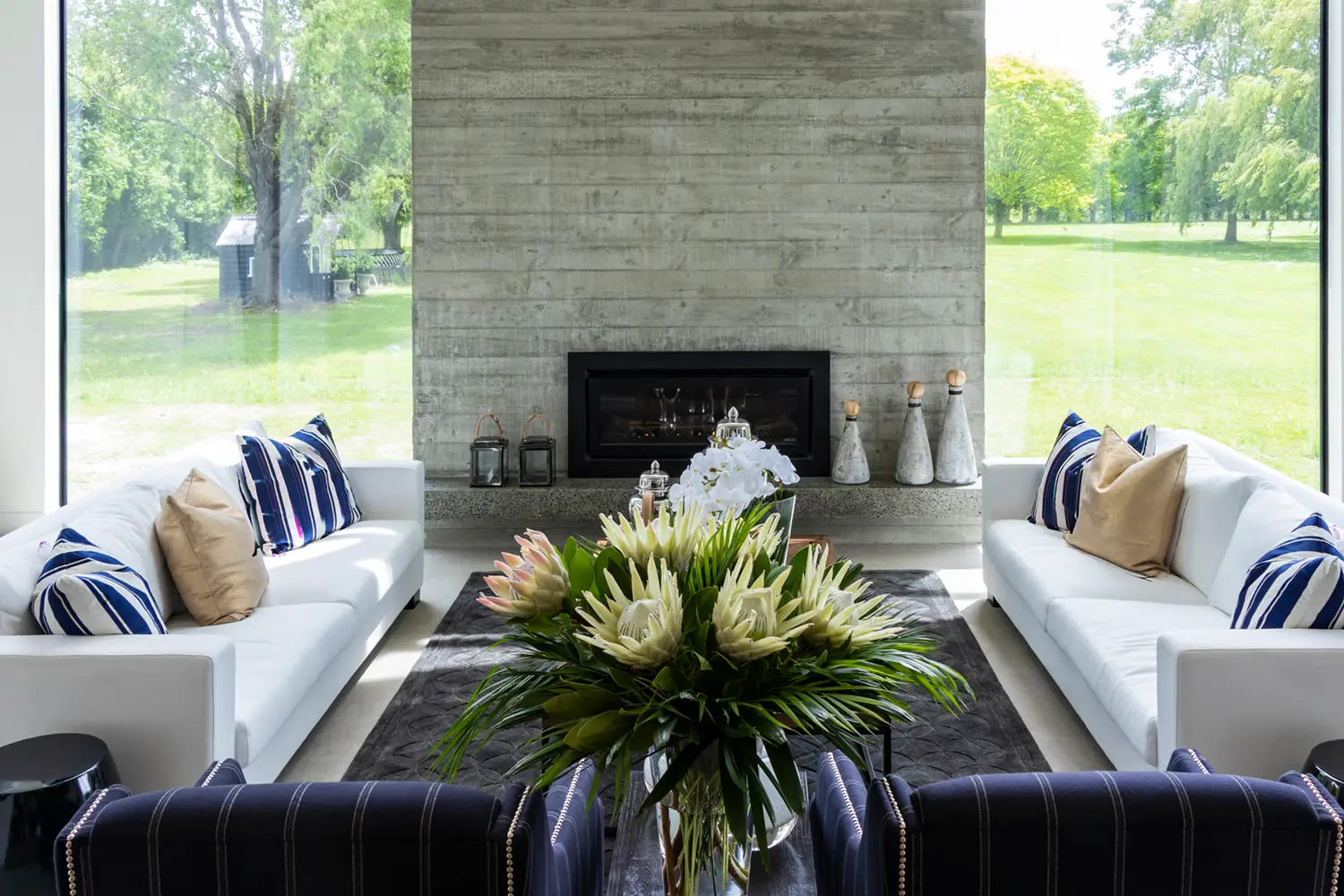 Modern living room with fireplace and large windows