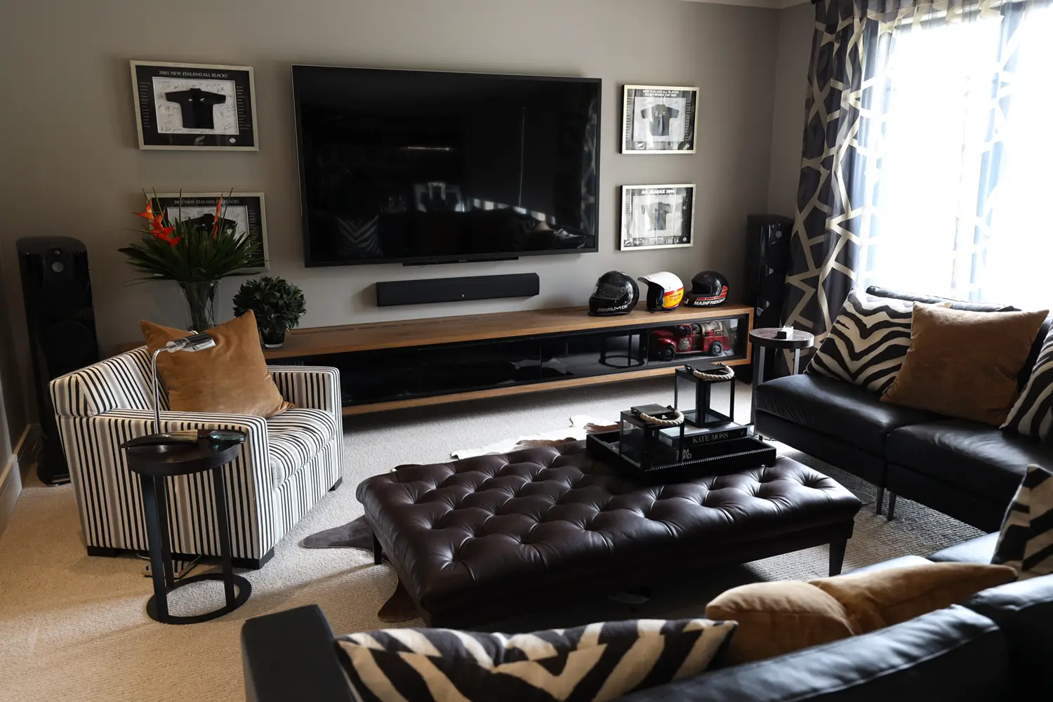 Elegant living room with large TV and stylish decor