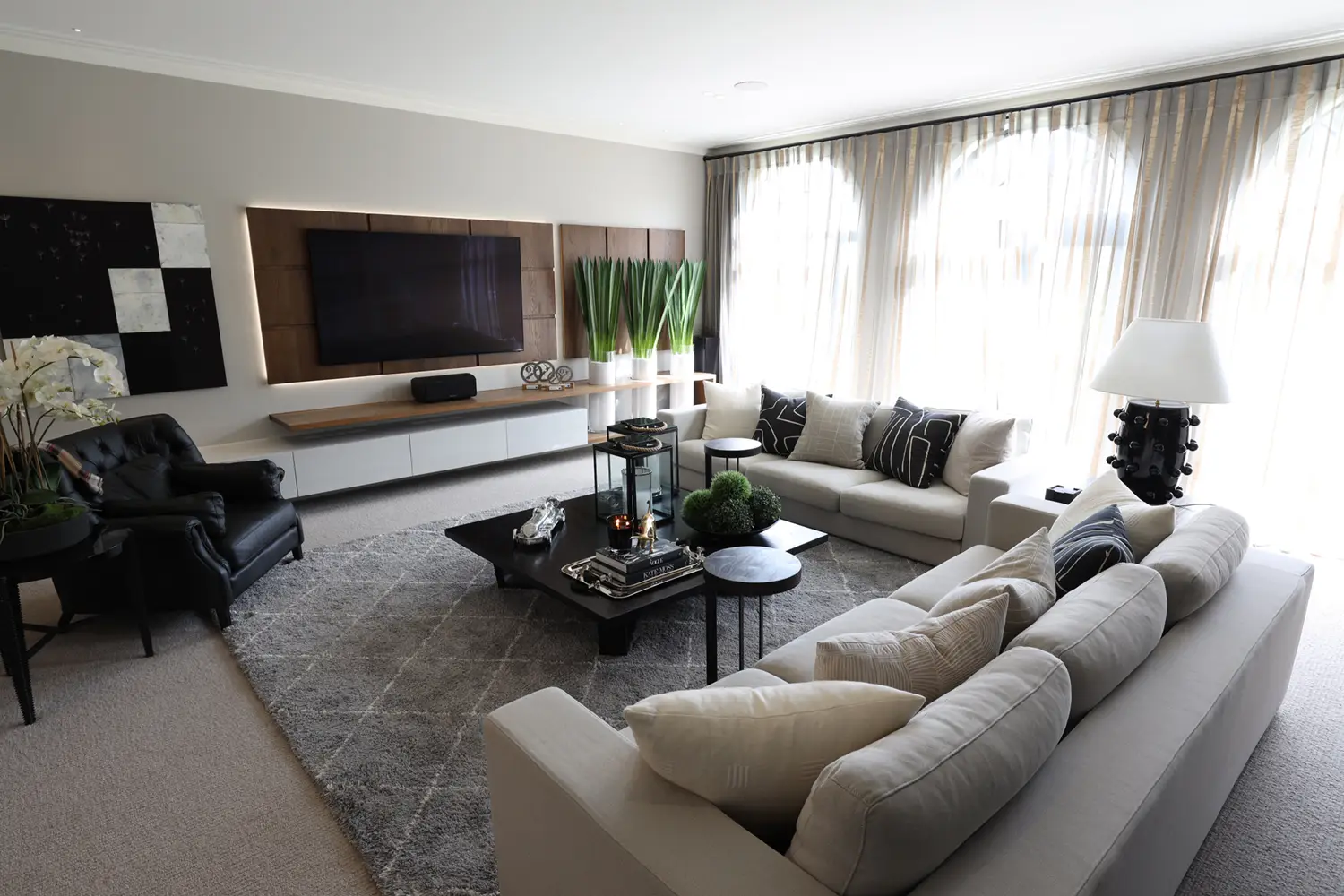Elegant modern living room with large TV and sofa