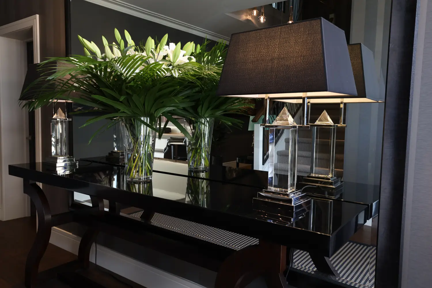 Elegant interior with lush plants and stylish lamps