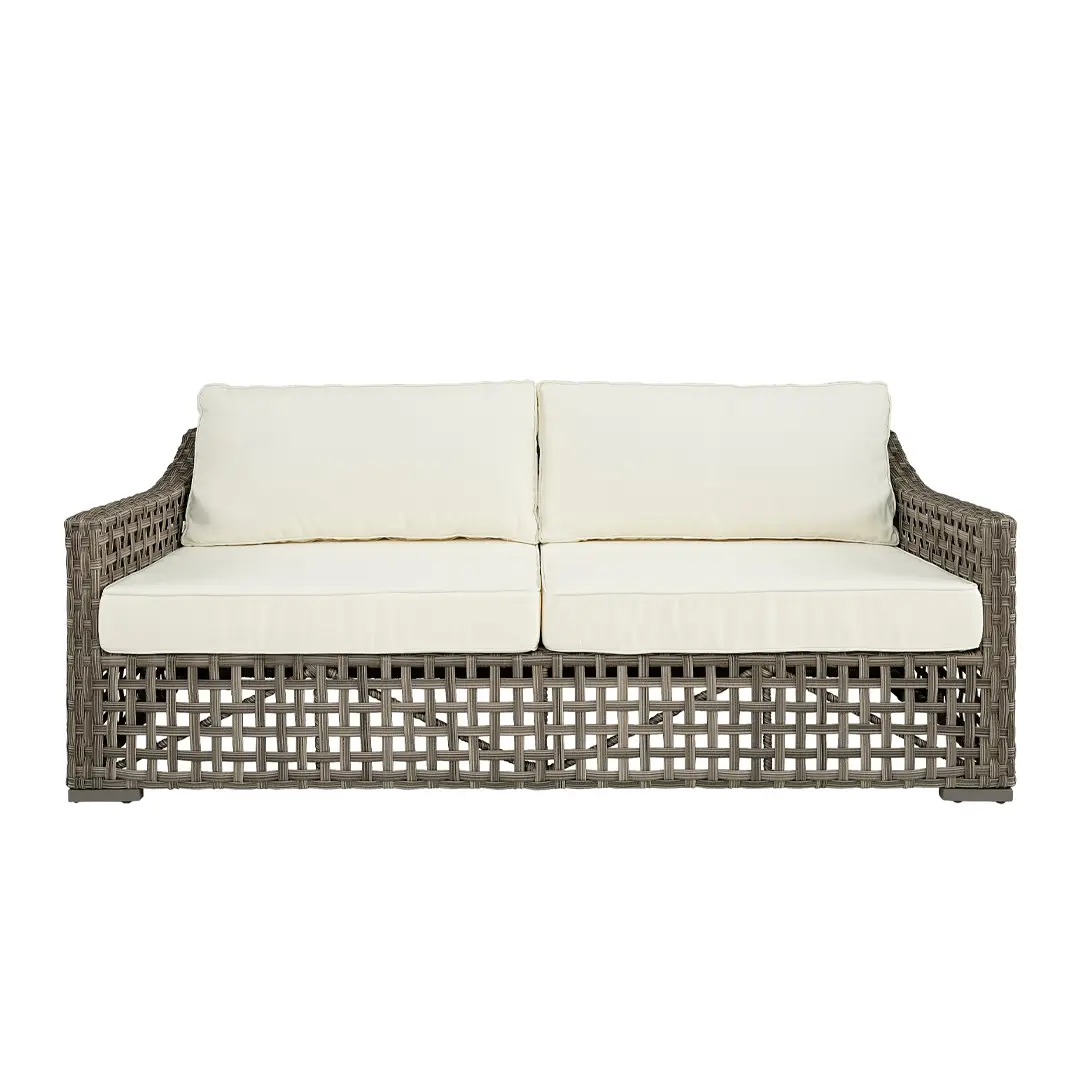 Wicker outdoor sofa with white cushions