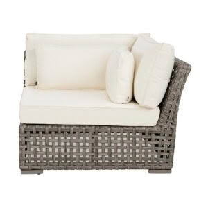 Wicker loveseat with cream cushions isolated