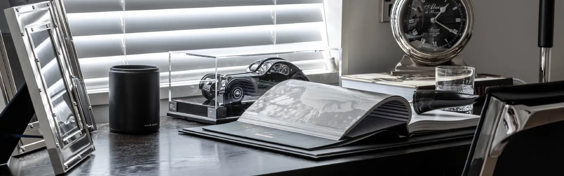 Stylish home office with decorative items and open book