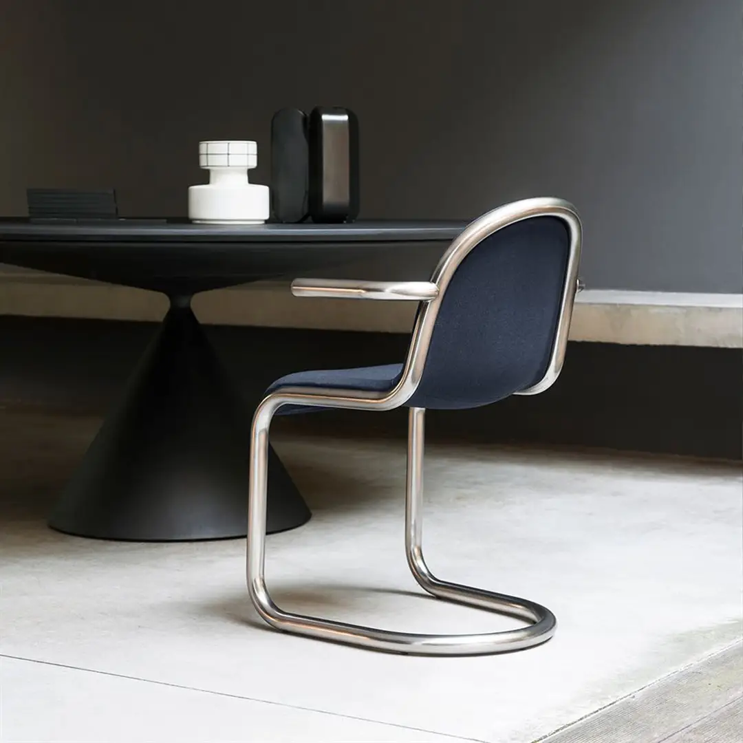Modern chair and table in stylish minimalist interior.