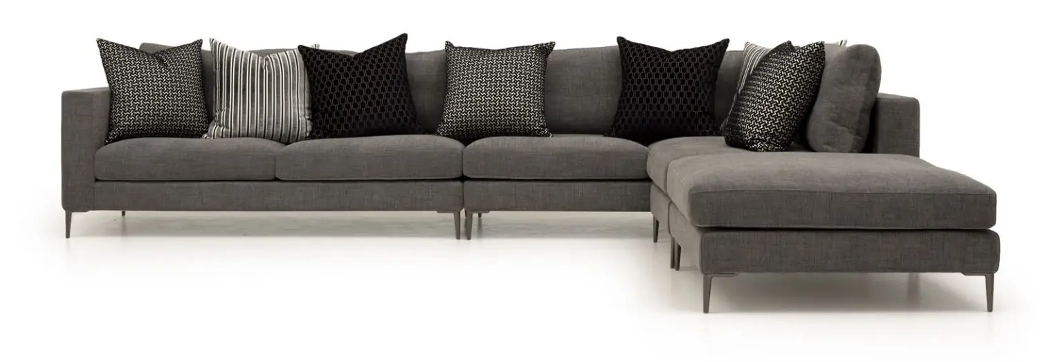 Modern gray sectional sofa with decorative pillows