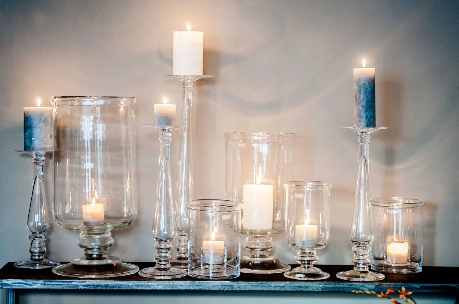 Elegant candles in glass holders on a serene tabletop