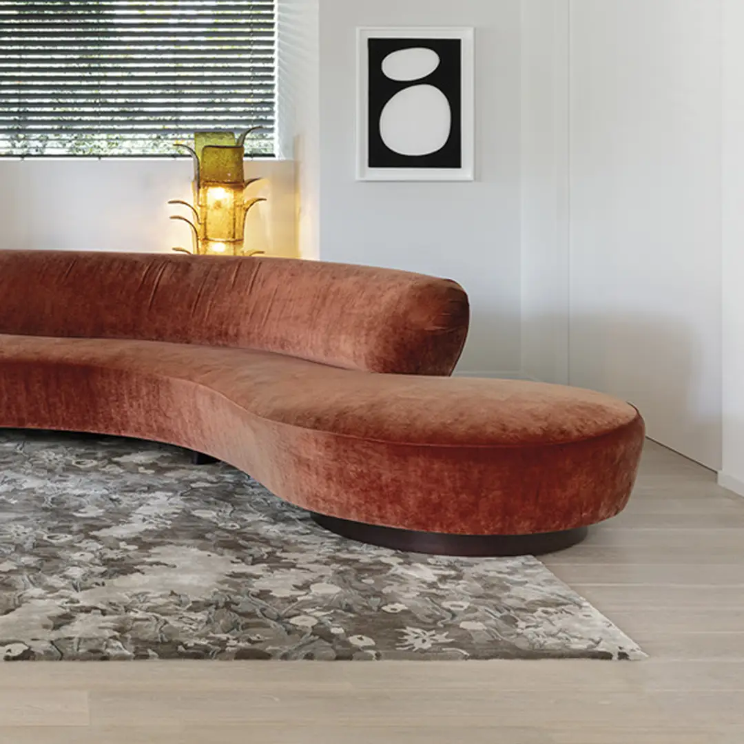 Curved velvet sofa in modern living room