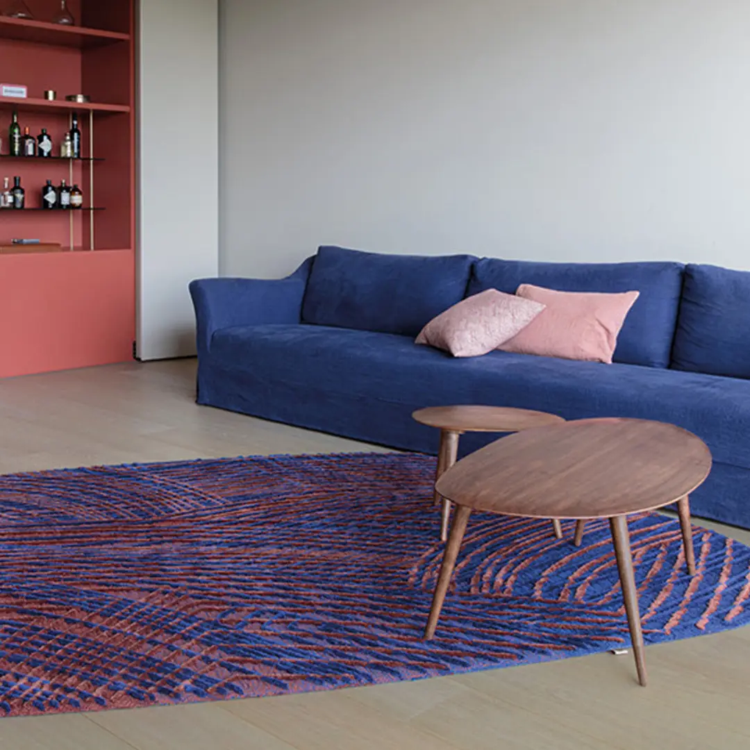 Modern living room with blue sofa and wooden table