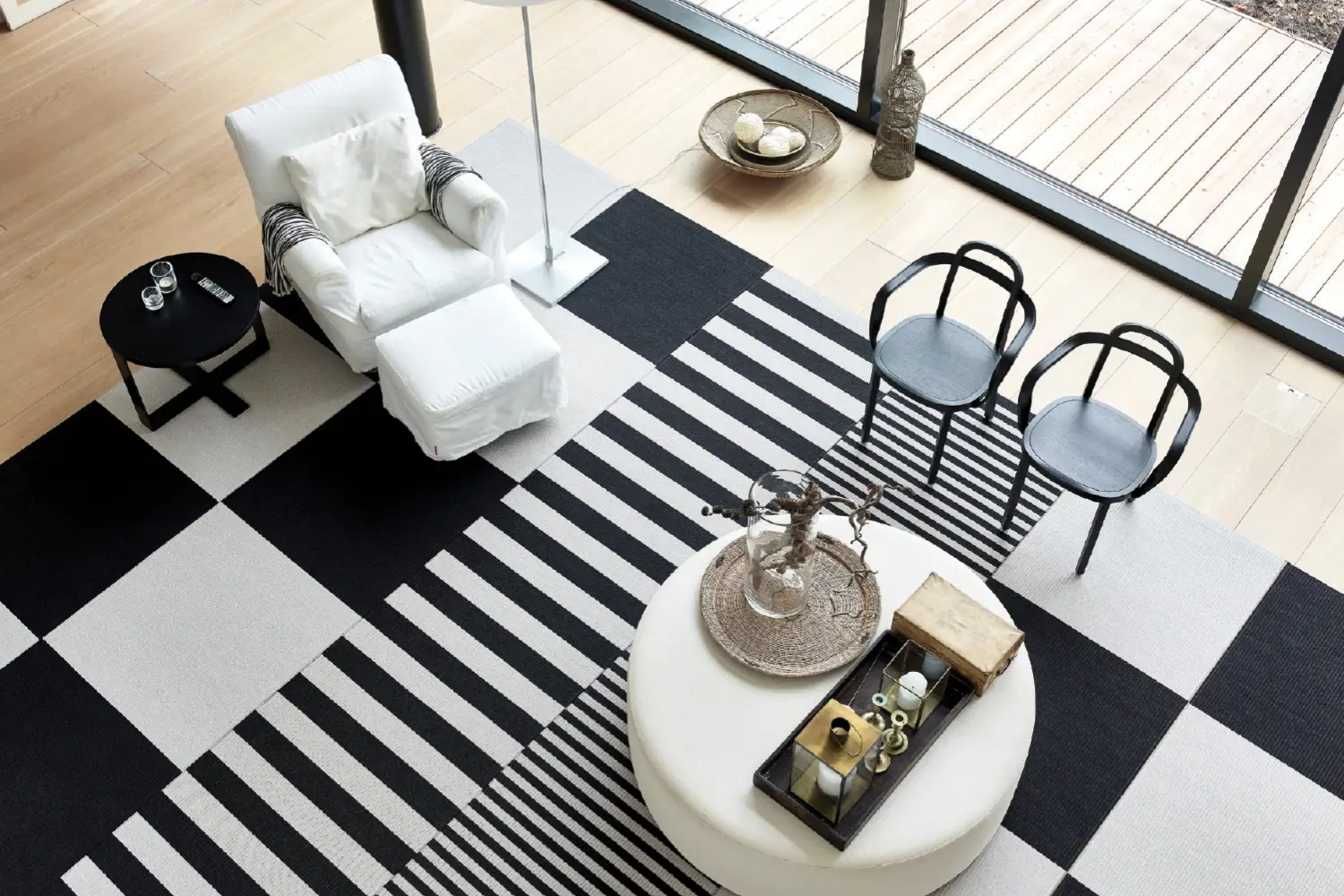 Modern living room with striped rug and stylish furniture